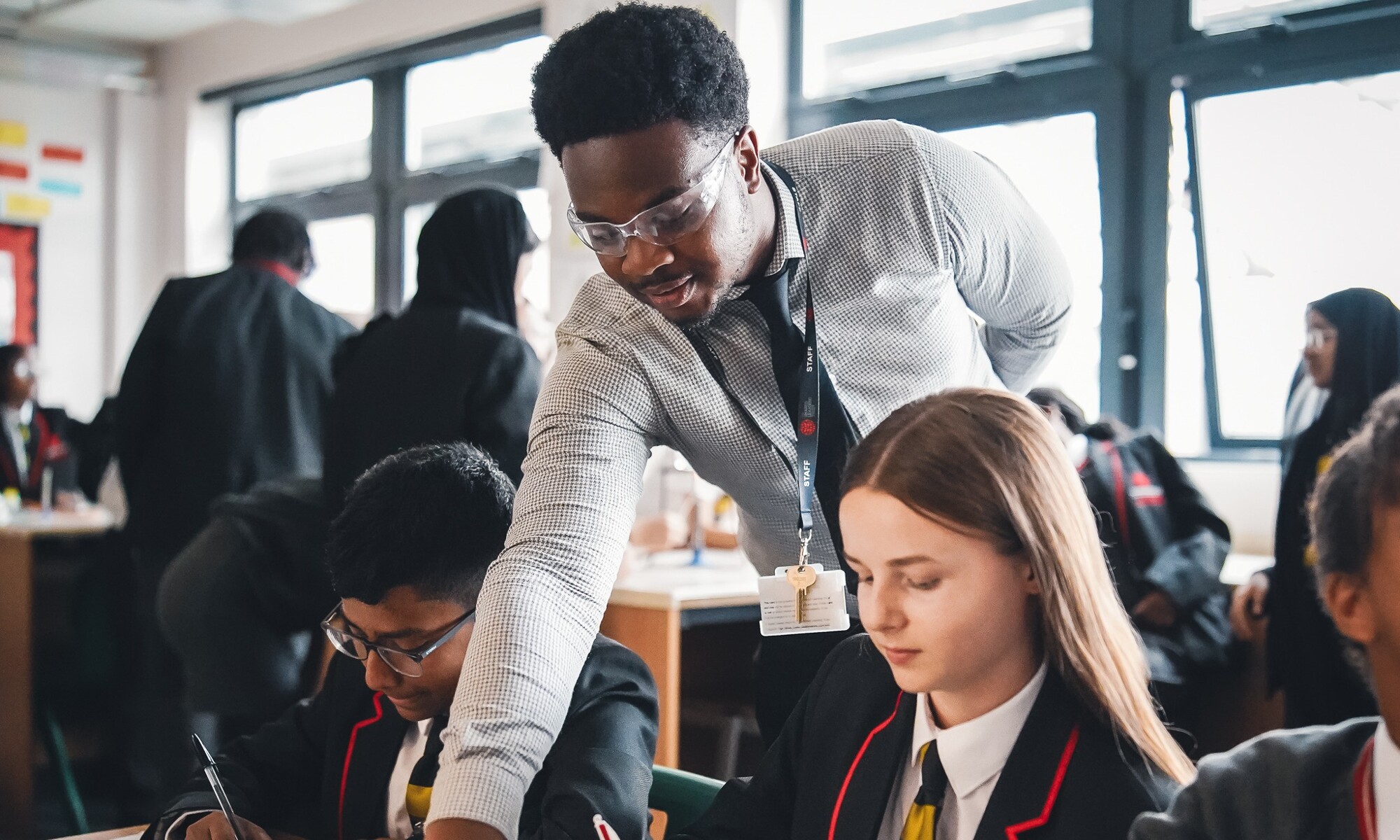 The Chalk Hills Academy teacher helping pupil with their work